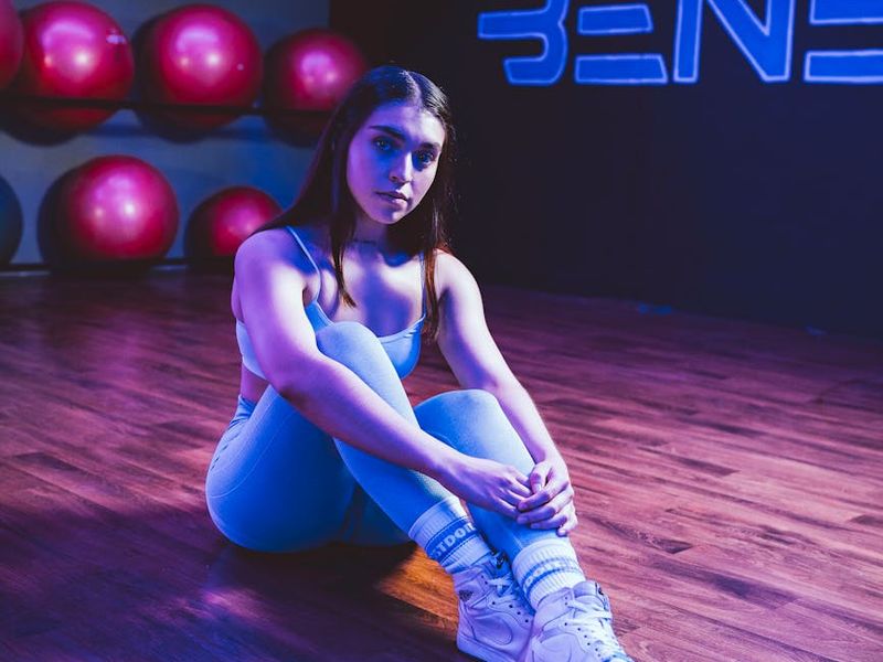 Detailed view of gym floor with neon ice light reflection.